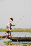 Man poling a canue, Lac Nakou, Benin