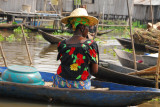 Woman in a canoe at the Ganvi floating market