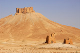 Volcanic cone with Palmyra Castle and a pair of ancient tombs
