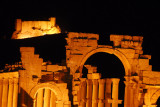 Monumental Archway and Arab Citadel, Palmyra, illuminated at night