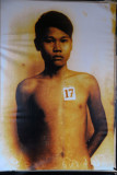 Colorized photograph of a teenaged prisoner murdered by the Khmer Rouge