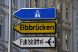 Road sign for Hamburg Fuhlsbttel Airport and Elbe Bridges (Elbbrcken)