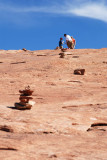 Cairns identify the Delicate Arch Trail on the blank sandstone