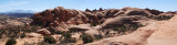 Five-image panorama from atop one side of the alcove blob; Delicate Arch is hidden behind dark ridge at upper center