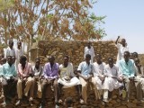 Students sitting on the school building