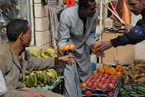 Bargaining ferociously for oranges in Aswan.