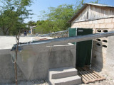 gutters on the buildings that drain into this tank, which is used for their driking water