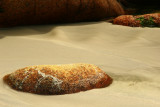 Boulder in a stream on the beach, Porth Nanven