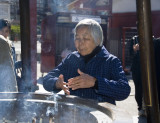 Inhaling incense smoke at the Asakusa Shrine