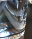 Reflection of a fork in a water glass