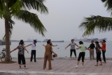 Morning exercise by the seawall