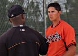 Steven talking with his pitching coach, Alan Mills, after pitching the top of the 1st. 