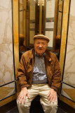 Photographer sits in elevator