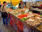 A fish vendor at the Venice Seafood Market