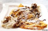 A crepe with ice cream, chocolate and nuts, oh and a little whip cream.