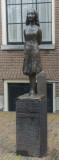 a small statue outside the house where the Frank family was hiding