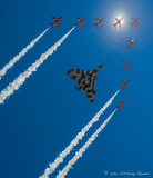 Farewell to the Vulcan: the Red Arrows cross the sun in a formation flypast with the Vulcan