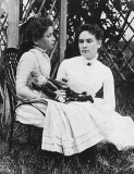 July 1888 - Anne Sullivan with Helen Keller holding a doll