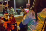 Taking a picture of the kids with Santa Claus