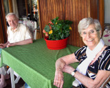 Two elderly people enjoying their balcony