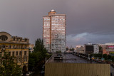 The setting sun lights a building on New Arbat Street