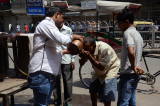It is a hot day - community volunteers helping anyone to get hydrated