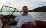 TC at Helm Red Boat.jpg