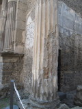 Marble column of brick and marble stucco