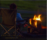 A Camper Enjoying The Campfire Ritual  