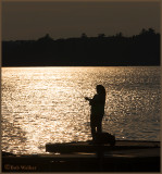 Fishing Off The Dock At Sunset 