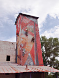 Close-up of feed mill tower decorated by local artists