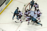 Joe Pavelski trying to prevent Marek Zidlicky from reaching the puck