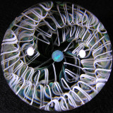 Seeeeriously sweet marble here, made by Aki, with one of Tomomis sections on the backside of a vortex.