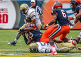 Yellow Jackets RB Laskey attempts to break away from Orange LB Marqez Hodge