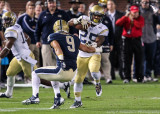 Tech A-back Robert Godhigh avoids the tackle of Pittsburgh DB Ray Vinopal