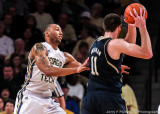 Jackets F Holsey gets in front of Fighting Irish C Sherman