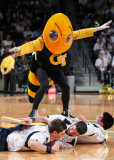 Georgia Tech Yellow Jackets Mascot Buzz does some court surfing during a timeout