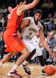 Yellow Jackets F Robert Carter Jr drives past Hokies F van Zegeren