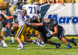 Duke LB Helton tries to stop Jackets QB Tim Byerly in the backfield