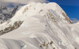 Flying past snow covered peaks