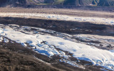 Flying over Ruth Glacier as it passes through the Tokosha Mountains south of Mount McKinley