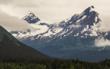 Mountain tops in the clouds from the Seward Highway