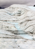 Water cascades down Root Glacier in Wrangell-St Elias National Park