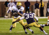 Jackets B-Back Marcus Allen braces for a hit from Braves LB Damon Watkins