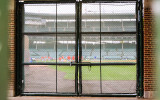 Looking into Wrigley Field through the fence on Sheffield Avenue