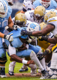 Jackets defenders separate Heels QB Williams from his helmet