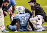 Heels CB Des Lawrence is attended to by trainers during the game