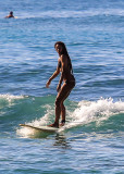 Surfer in the water off of Waikiki Beach