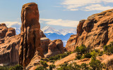 The La Sal Mountains through rock formations along the Devils Garden Trail in Arches National Park