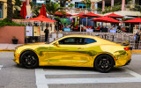 Shiny gold Camaro on South Beach